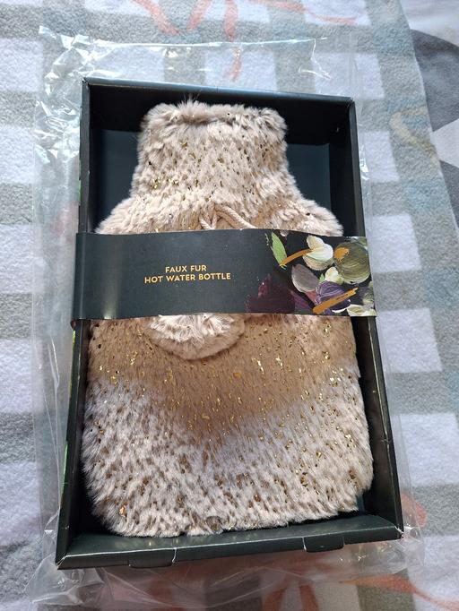  — brand new fluffy hot water bottle