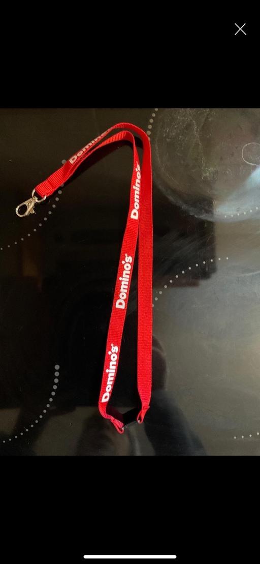  — Dominos Lanyard