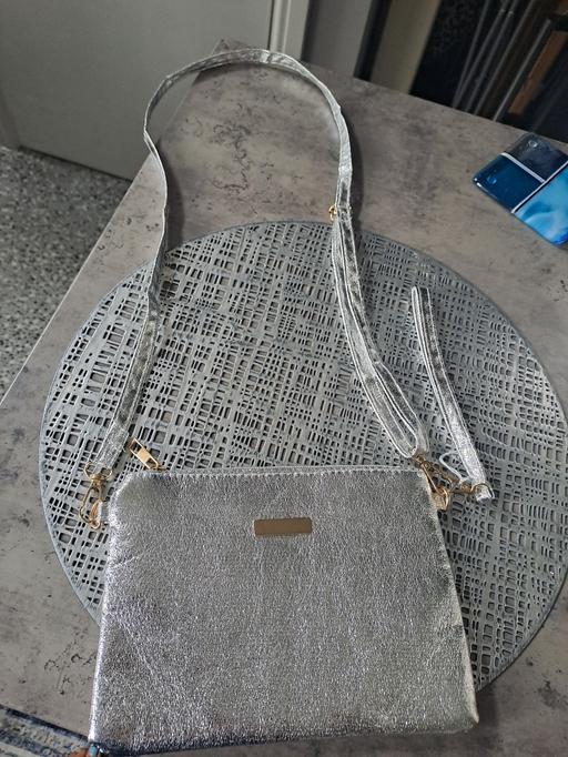  — silver shoulder bag