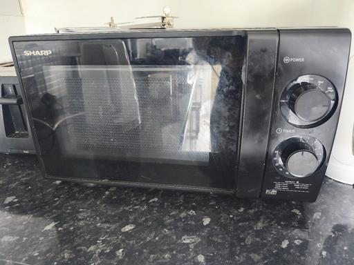  — black microwave hardly use like new