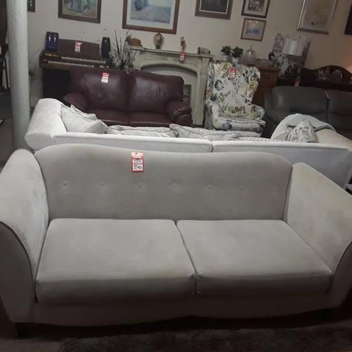 — DFS beige fabric three-seater sofa