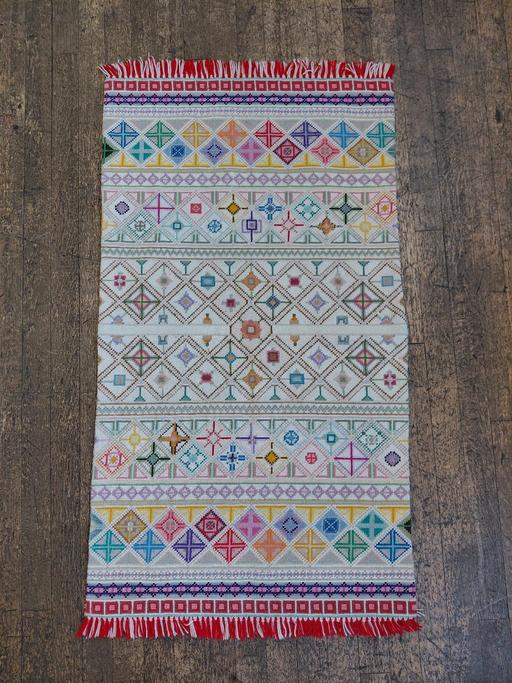  — HAND STITCHED MULTI COLOURED RUG. 130cm.
