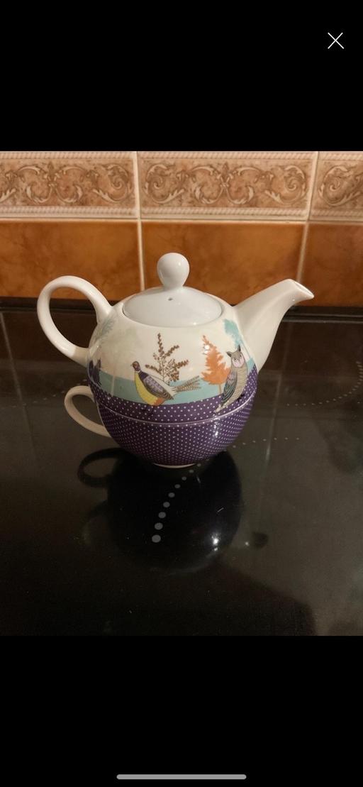  — T-Pot and Cup