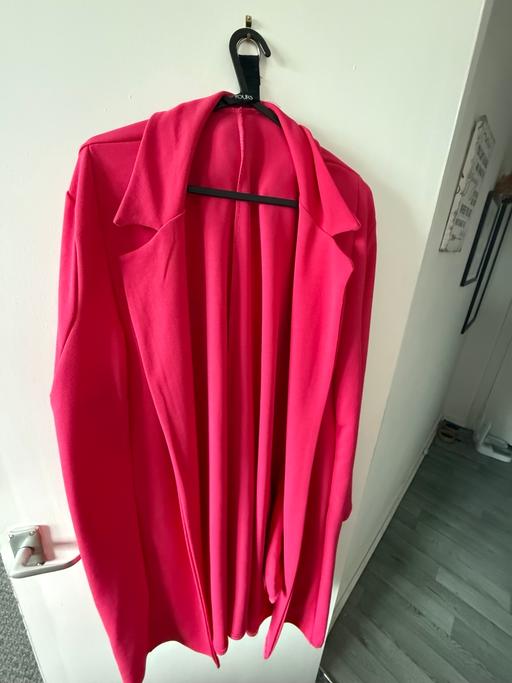  — Pink blazer worn once