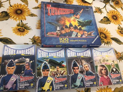  — Thunderbirds Jigsaw and 4 DVDs.