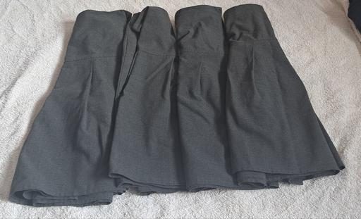 — 4 Girls School skirts by M& aged 12-13 years