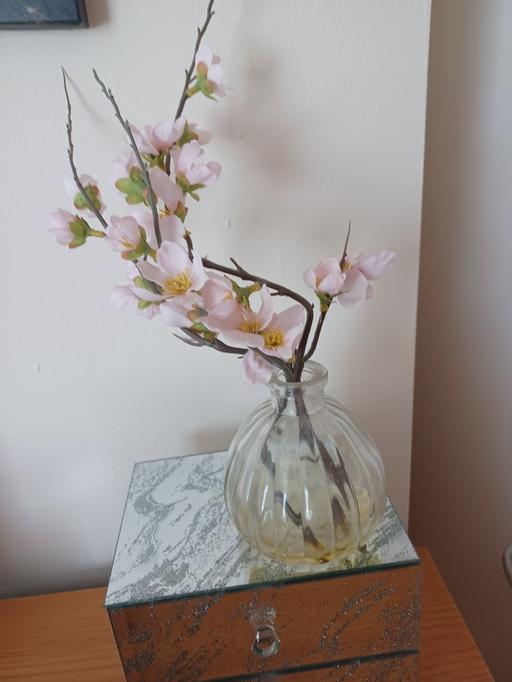  — artificial flowers in glass vase