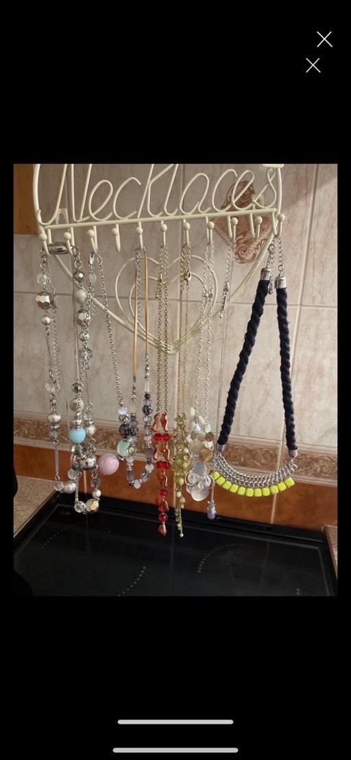  — Costume necklaces