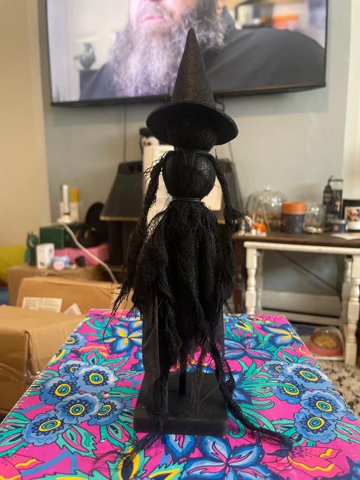  — Dark cloth witch figure