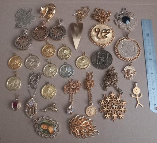  — Large collection of gold plated pendants