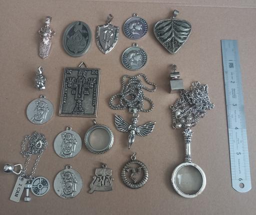 — Collection of silver plated pendants a