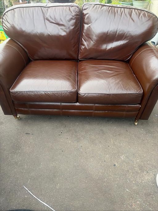  — Leather sofa brass/wood castor feet