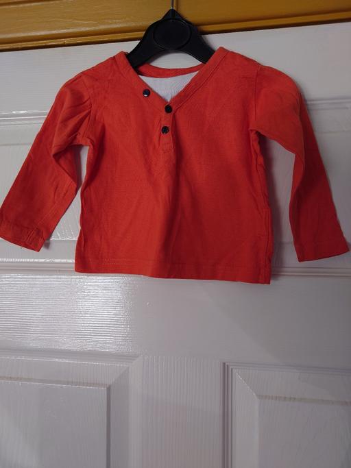  — Baby boys orange long sleeve top size 9-12M