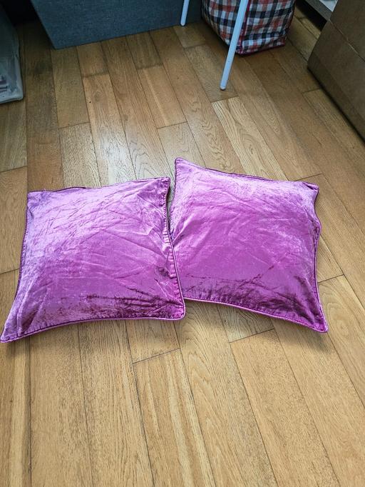  — 2 Laura Ashley cushions.