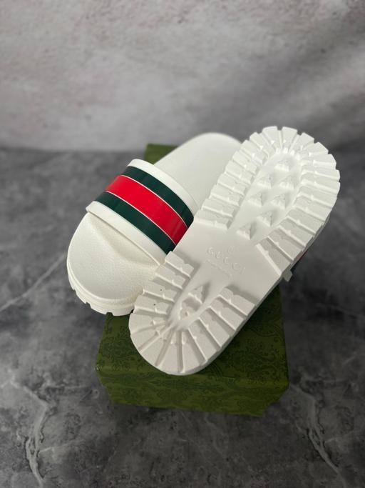  — White Gucci slides