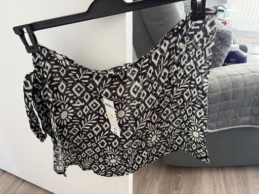  — Women’s swim suit and skirt,
