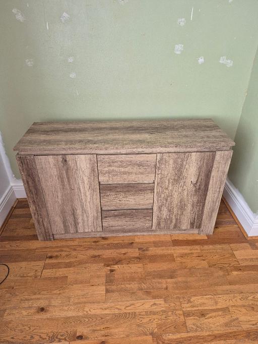  — distressed wooden sideboard.
