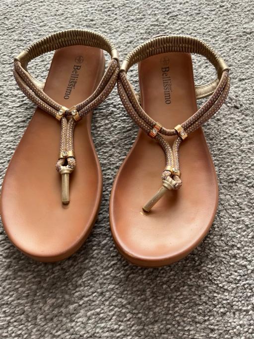  — Ladies gold sandals from Pavers