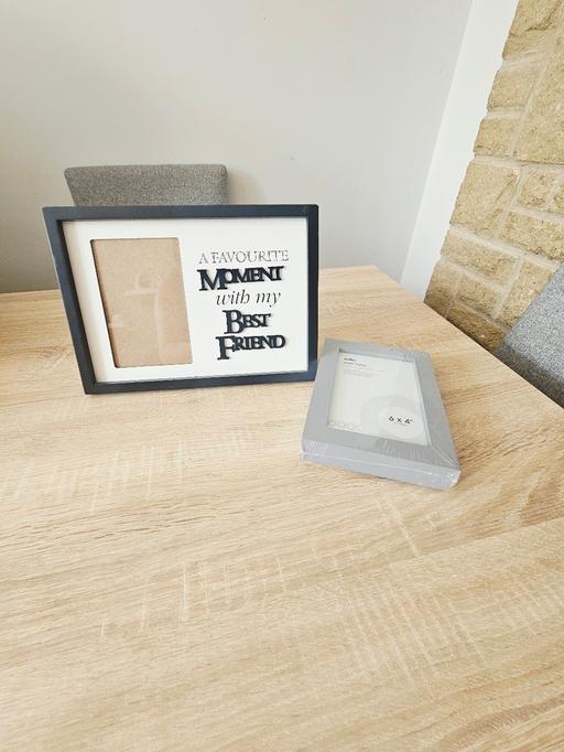  — 2 photo frames.
