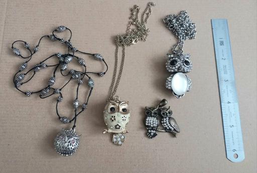  — Collection of gemstone owl pendants