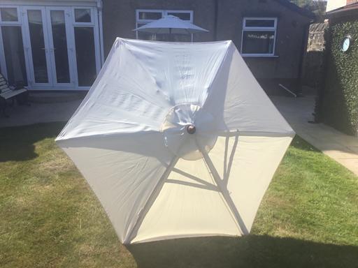  — Cream patio umbrella