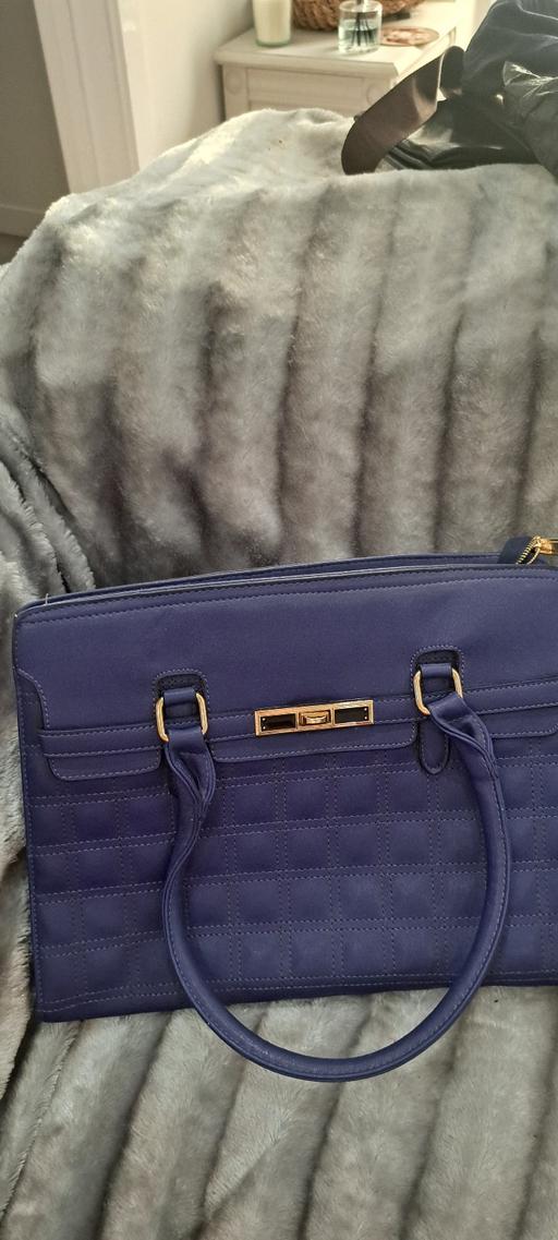  — Handbag
