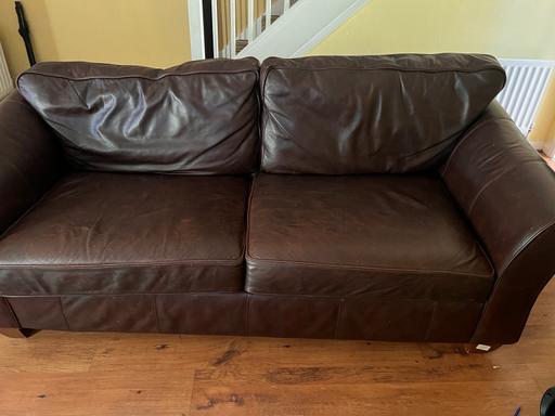  — Brown leather sofa