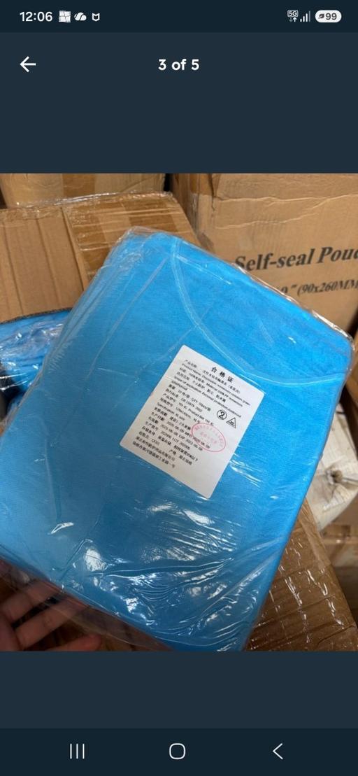  — Disposable isolation gown in blue
