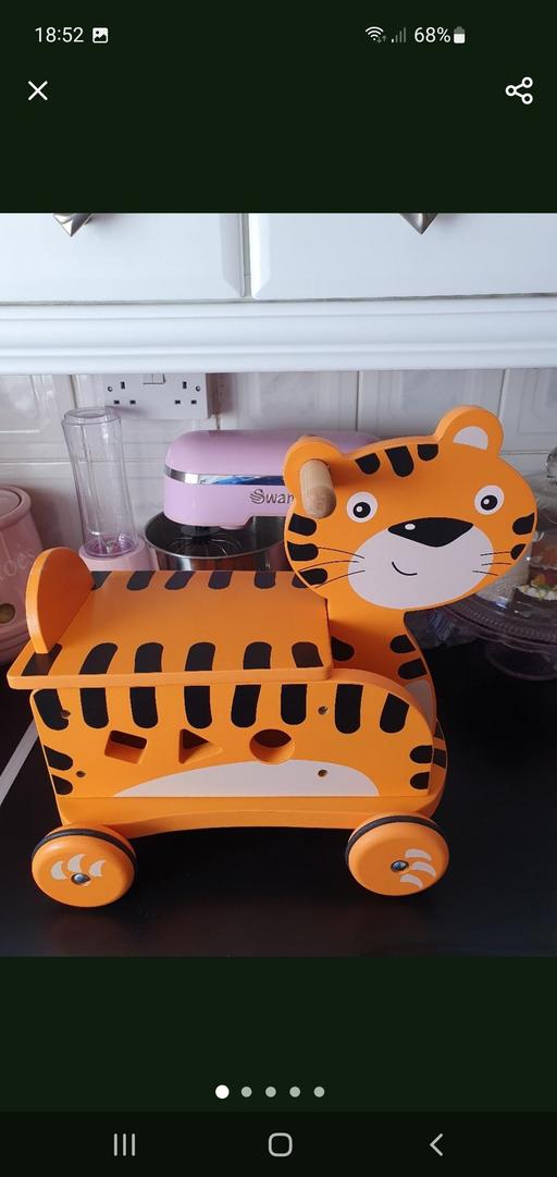  — children's wooden ride on toy with bricks
