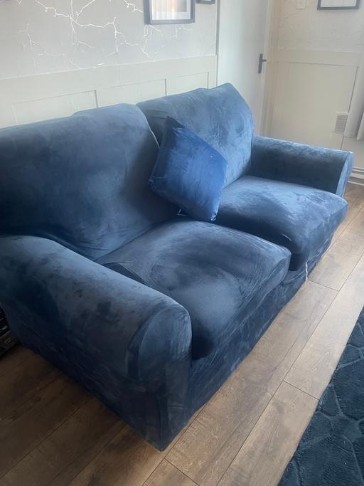  — Solid sofa bed with blue stretch covers
