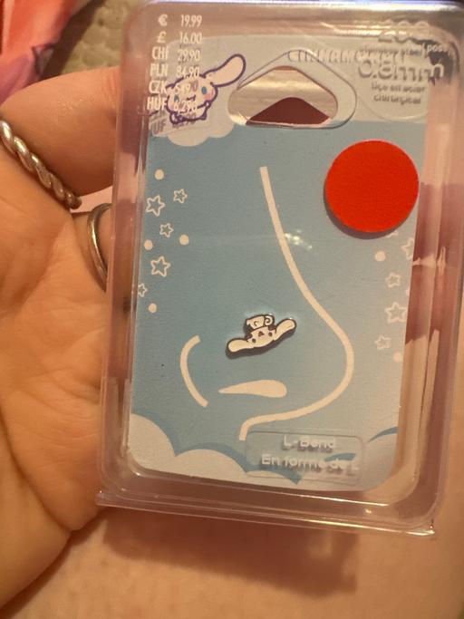  — Hello kitty friends nose piercing + bracelet.