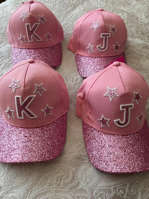  — Girls baseball cap. Initial “J” or “K.Glitter