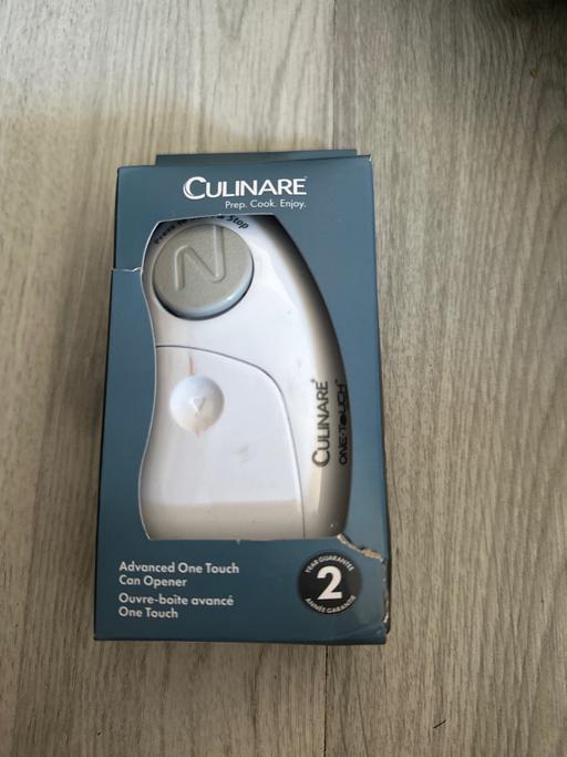  — Electric can opener