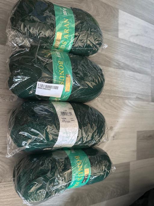  — 4 balls of green wool