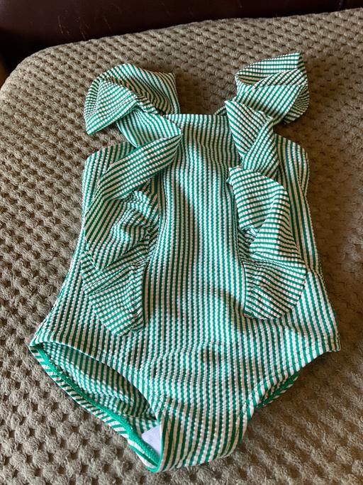  — swimming costume