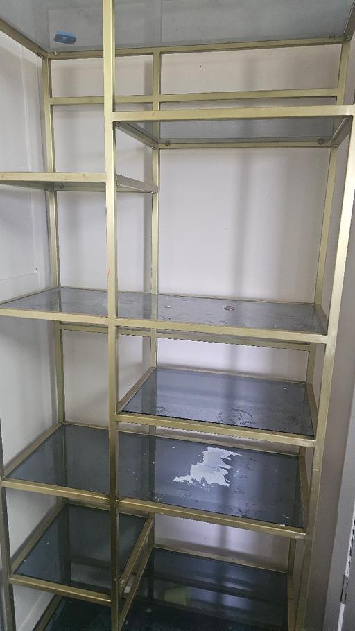  — Gold standing shelf