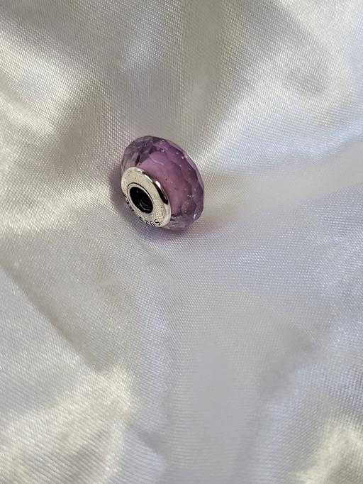  — Pandora. Faceted purple Murano glass with a s