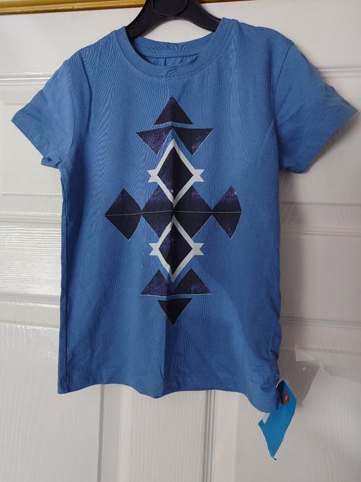  — Boys blue top size 6-7 years