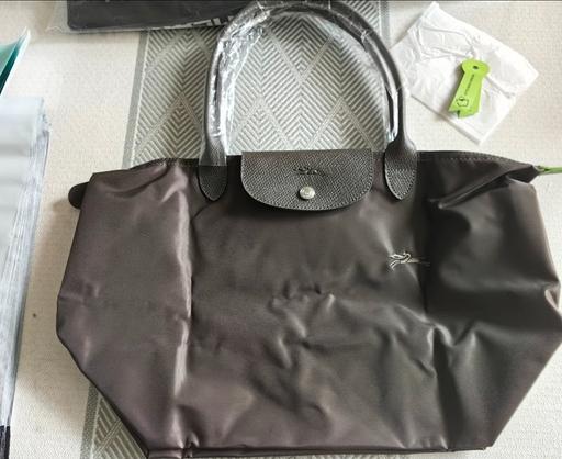  — brown longchamp handbag