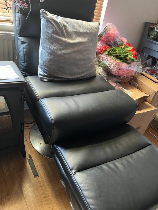  — Black leather chair with a footstool