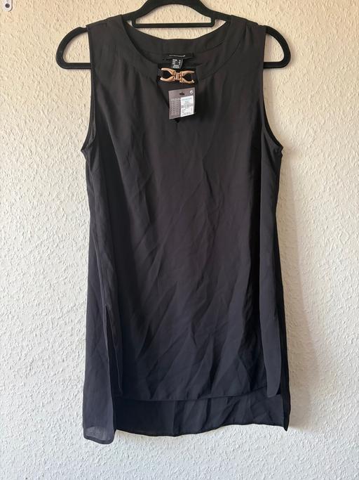  — Black sleeveless dress