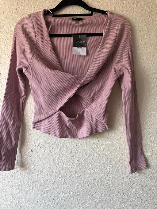  — Pink wrap top