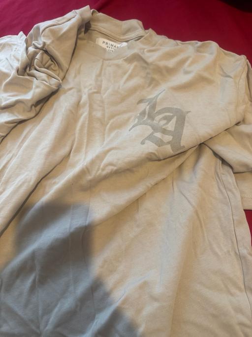  — LA T-SHIRT