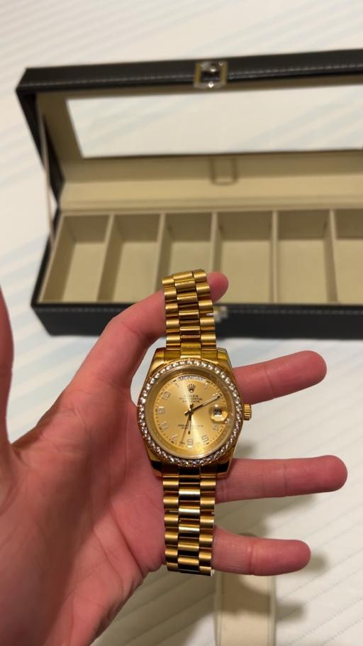  — Men’s gold watch