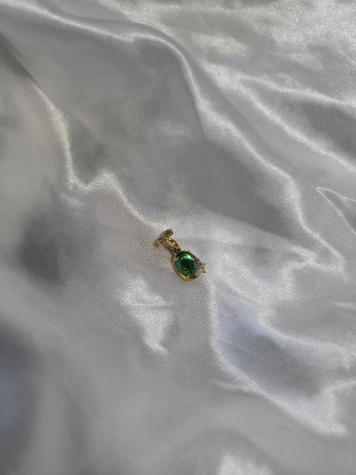  — Pandora dangle charm featuring a green crysta