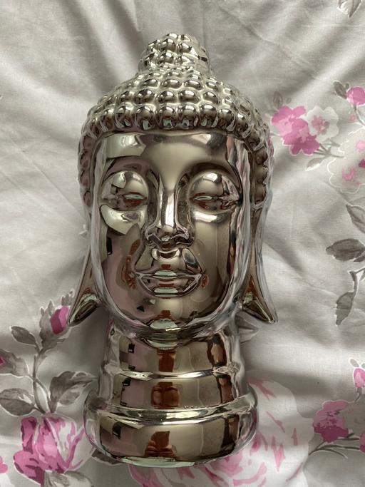  — Silver Buddha