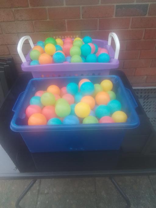  — TWO STORAGE BASKETS OF SOFT PLASTIC BALLS