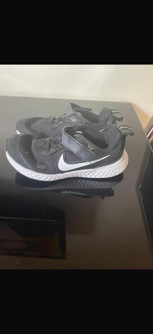  — Boys black Nike trainers
