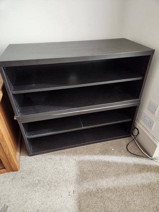  — black wooden shelving unit