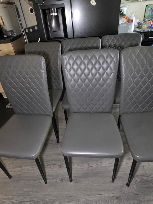 — 6 Grey leather chairs